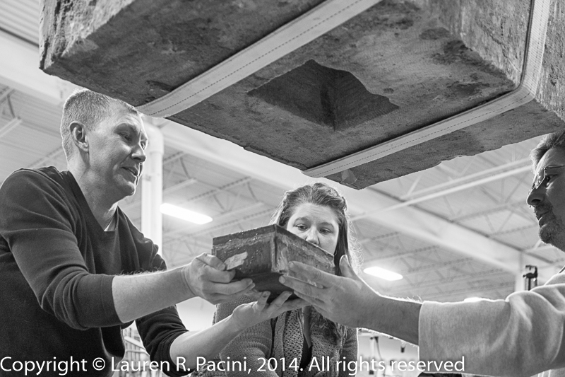 Jim Wamelink (WR Restorayion), left, Mallory Haas (Center for Community Studies) and Ryan (WR Restoration) Removing the Time Capsule